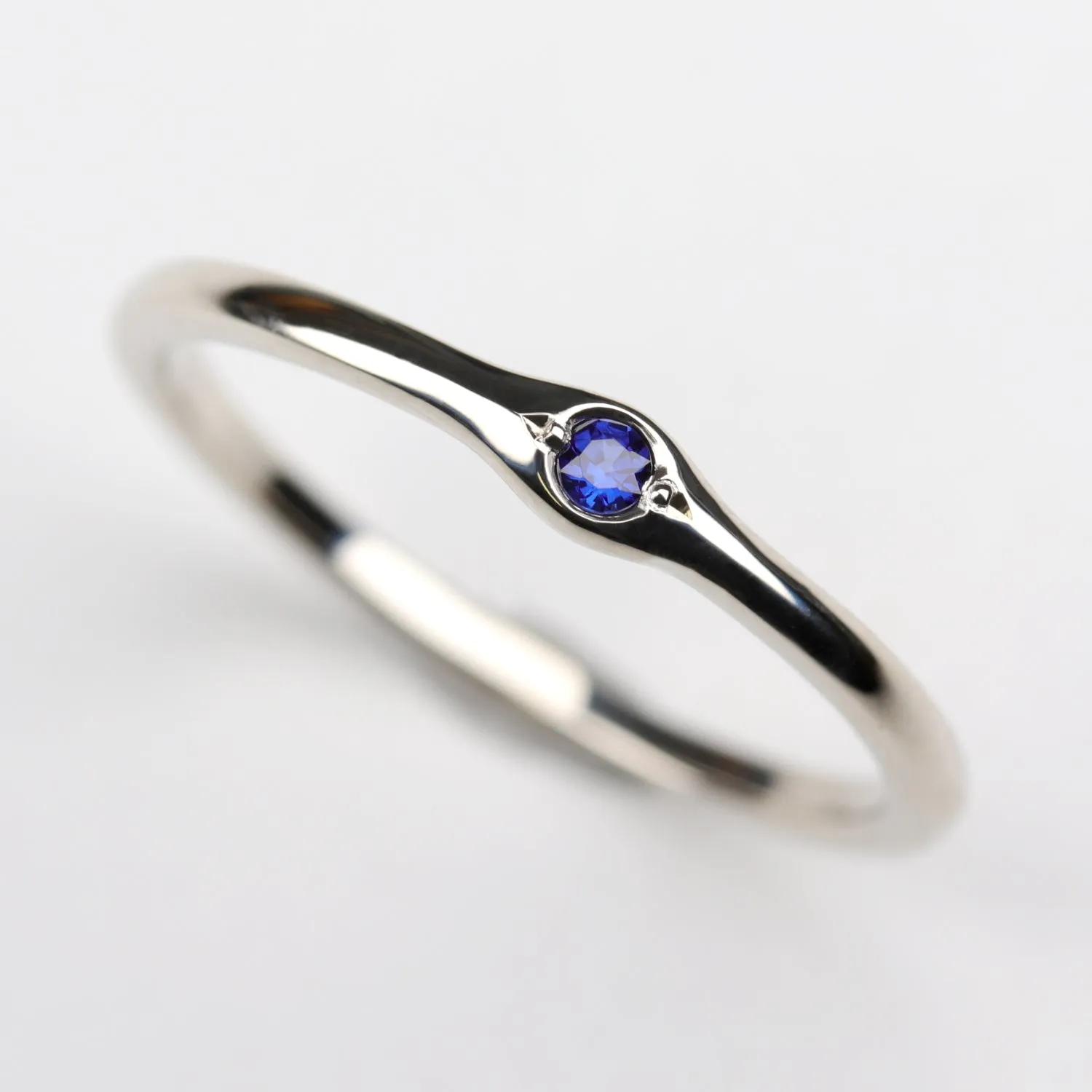 2mm Bump Ring with a Dark Blue Sapphire