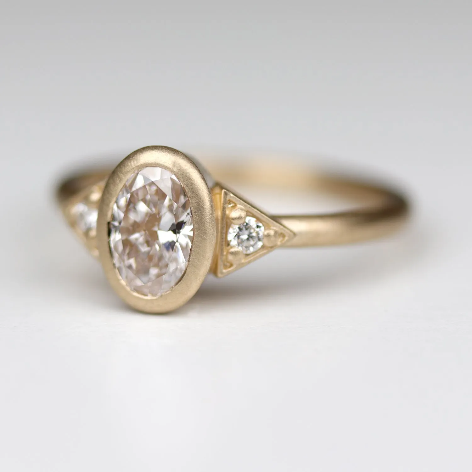 Custom Oval Deco Three-Stone Ring with a Diamond Foundry Diamond