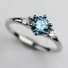 Three Stone Ring with Lab-grown Vivid Fancy Blue Diamond in Platinum